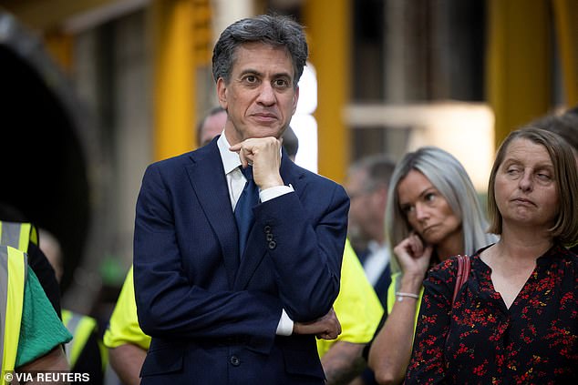 Ed Miliband smirks during speeches on visit to Cheshire yesterday