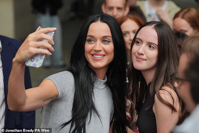 The singer posed for selfies with the crowd.