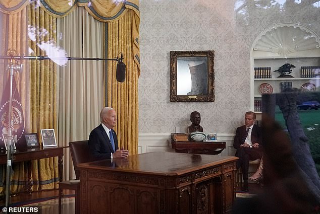 President Joe Biden delivers a speech from the Oval Office about his canceled campaign. His son, Hunter Biden, sits in a chair out of the camera's view.