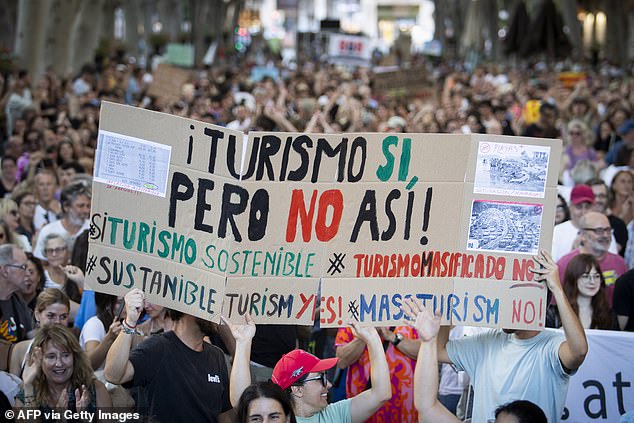 People hold a sign that says: 