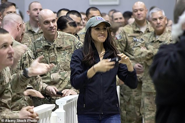 Meghan went on tour with the USO in December 2014. During the tour, she visited American airmen at RAF Mildenhall in Suffolk, other bases in Europe and Bagram Airport in Afghanistan. The Duchess, center, is pictured with service members during the USO holiday troop visit at Bagram Airfield on December 9, 2014 in Bagram, Afghanistan.