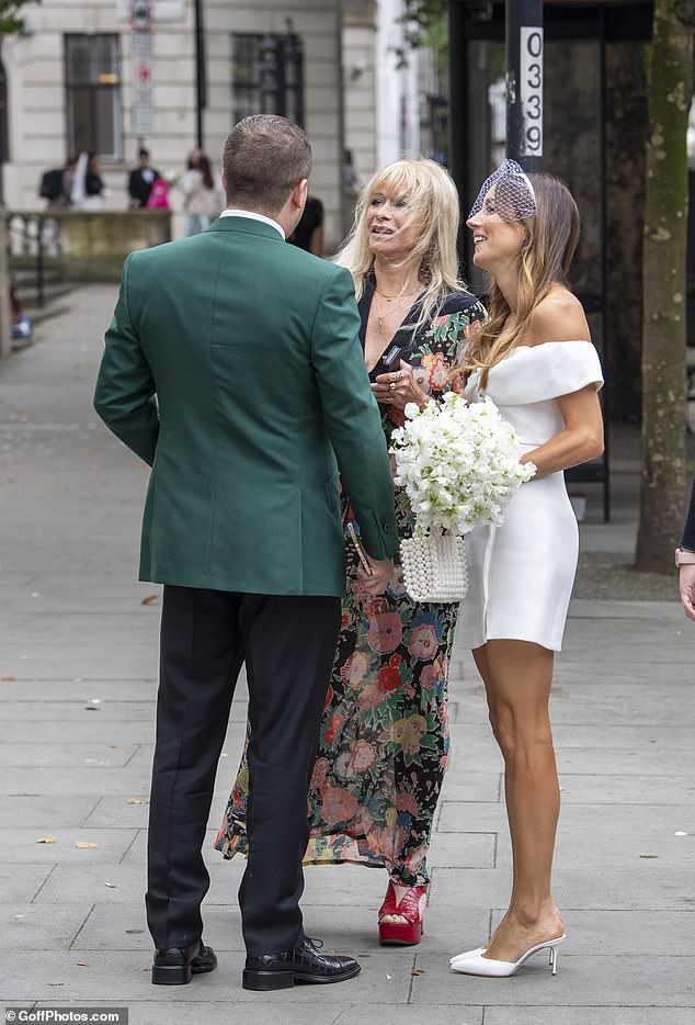 Meanwhile, the groom's mother Jo, 69, opted for a long floral skirt and striking red platforms.