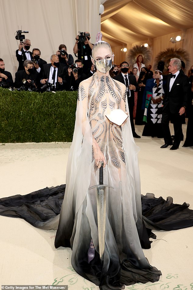 Last April, it appeared the two were back on good terms, based on an extremely brief exchange on X-rated. Grimes is seen brandishing a sword at the Met Gala in Manhattan in 2021.