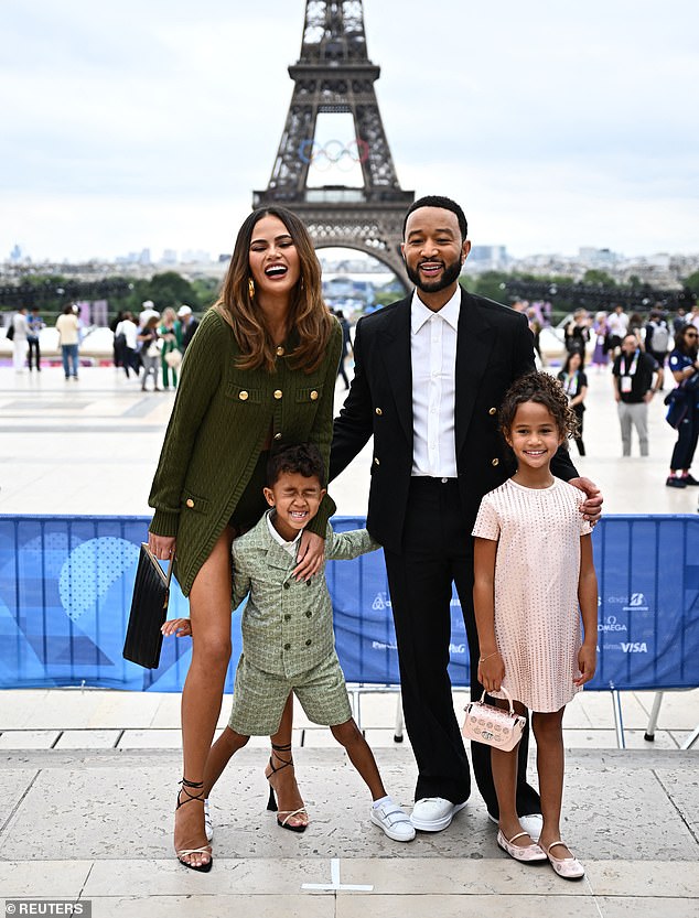 The 38-year-old model showed off her incredible figure in a khaki-coloured ensemble as she posed with her adorable family.