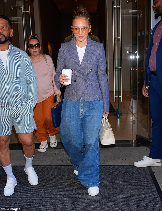 The Atlas star, who turned 55 on Wednesday, wore a grey-blue blazer that accentuated her slender waist with a white T-shirt underneath. Joining the star were her manager Benny Medina and her photographer Ana Carballosa.