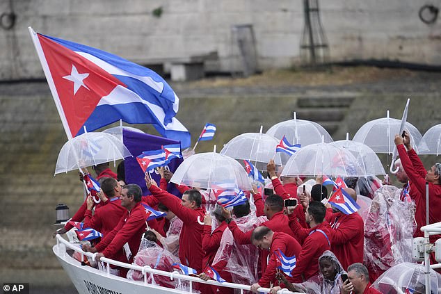 The ship carrying the Cuban team sails down the Seine