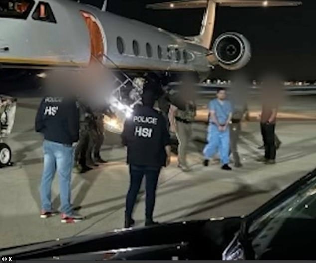 Joaquin Guzman Lopez is escorted by US federal agents after his surrender