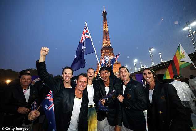 Tennis great Lleyton Hewitt (third from left) was among Australians celebrating the start of the Paris Games.