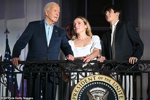 Biden (left) and his grandsons Finnegan Biden and Robert Hunter Biden II (right) watch the Independence Day fireworks display