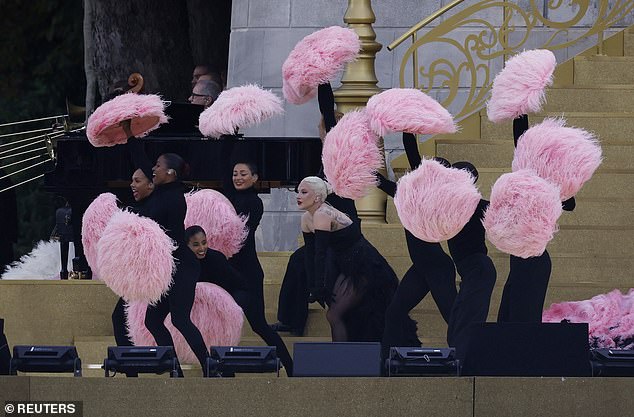 She sang entirely in French amidst a plume of pink feathers.