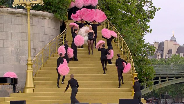 The star opted for a vintage Parisian cabaret-style performance, exaggerating her moves at every opportunity and singing entirely in French amid a column of pink feathers.