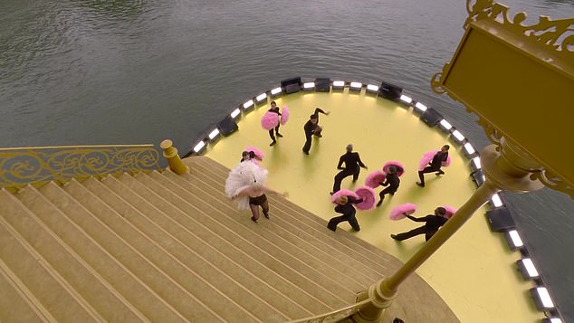 Its elaborate stage painted in shades of yellow was built directly over the dark, murky water of the River Seine.