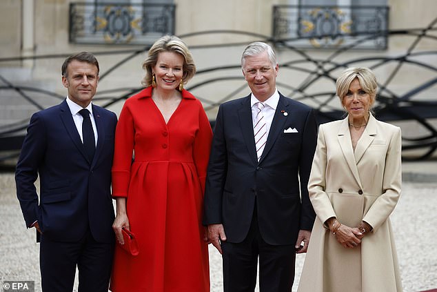 French President Emmanuel Macron and his wife Brigitte pose for a photo with King Philippe and Queen Mathilde of Belgium