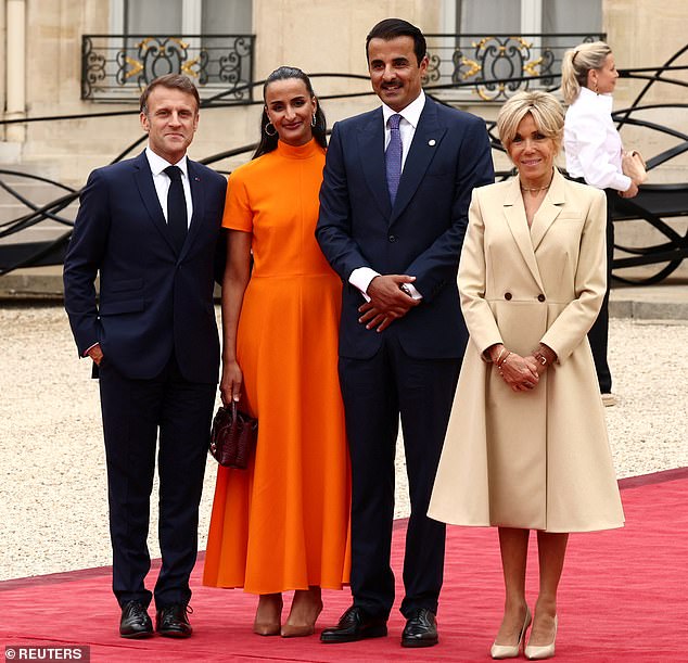 Pictured: Emir of Qatar Sheikh Tamim bin Hamad bin Khalifa Al Thani and his wife at today's event.