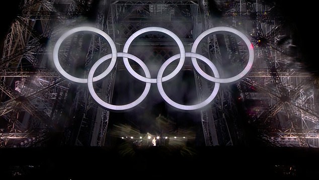 The Olympic rings lit up beneath the Eiffel Tower where Céline Dion performed at the opening ceremony