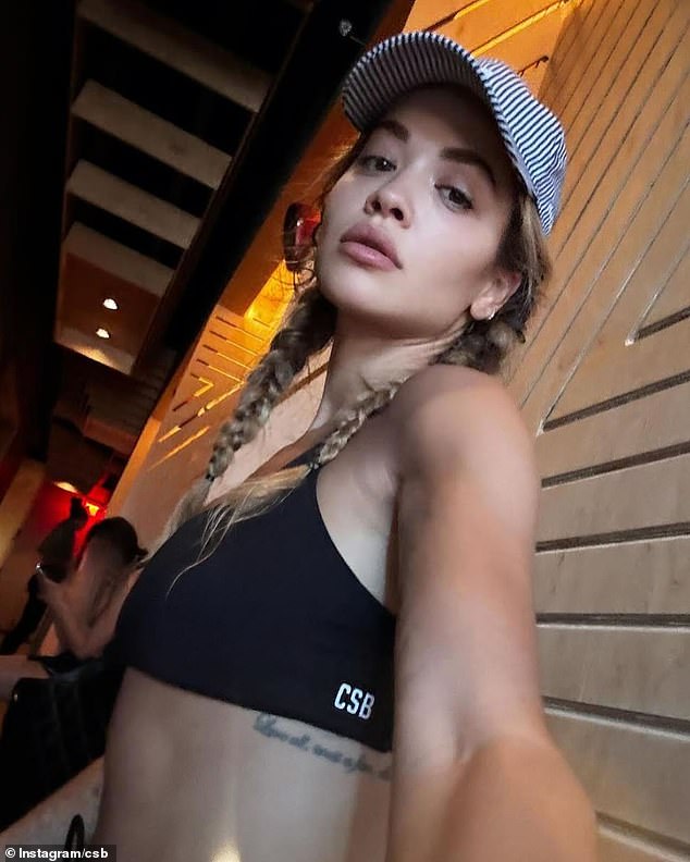 The fitness fanatic showed off her six-pack in a black bralette and matching drawstring bike shorts from Crop Shop Boutique, which retails for around $118.