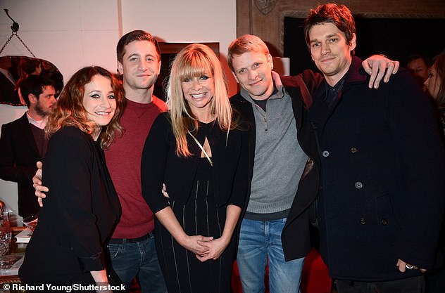 Jamie (grey sweats), who now has three children of his own, is not Ronnie's biological son but grew up with the musician, his mother Jo Wood and three siblings: Leah, Tyrone and Jesse.