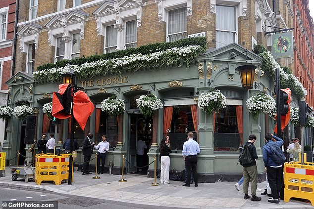 Family and friends moved to The George pub on Great Portland Street for the reception.