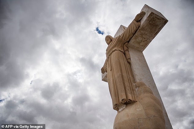 A 26-foot limestone statue of Jesus Christ sits atop the mountain.