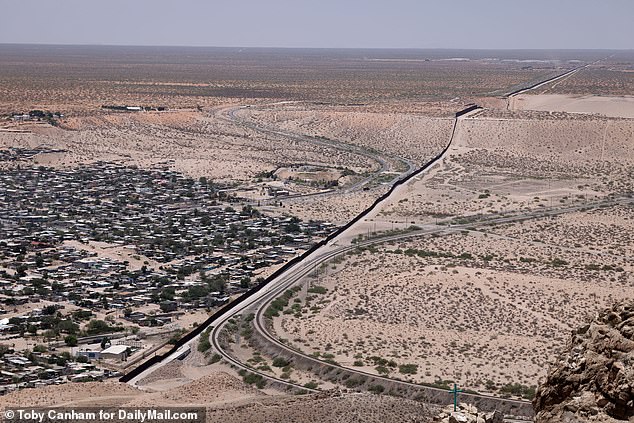 A view of the border wall from the top of Mount Cristo Rey