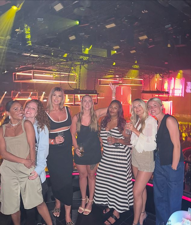 Lioness Leah Williamson (far right) also joined the gang for the well-deserved getaway, with the group posing for a glamorous photo at a nightclub.