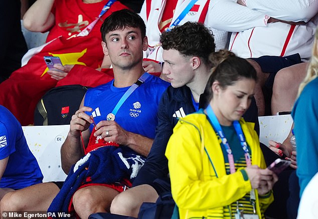 Tom Daley was seen knitting in the crowd, as he did in Tokyo, but he gave his full attention