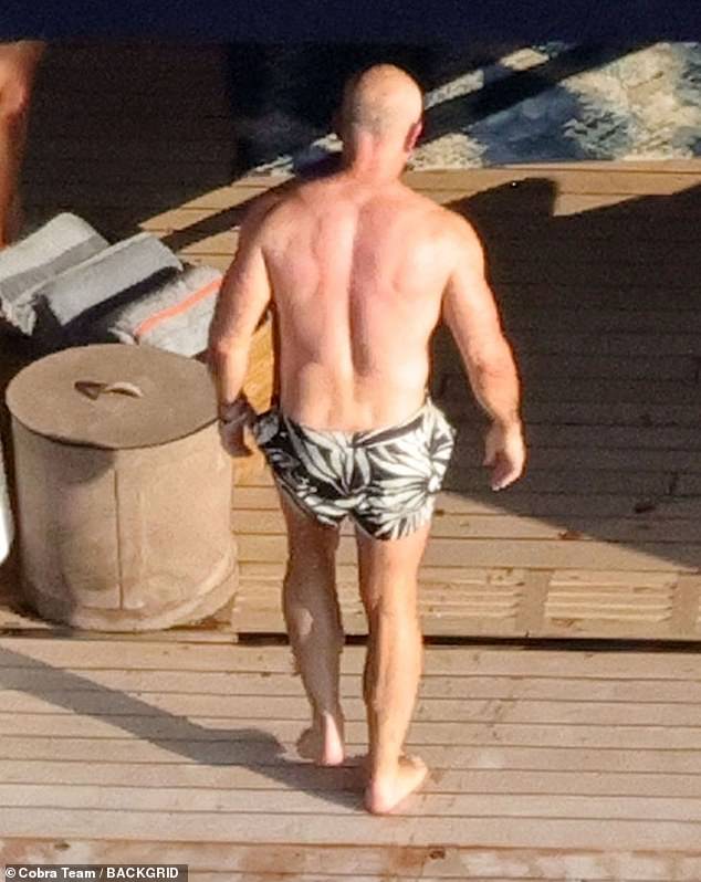 While the 54-year-old revealed her beach body in a scantily clad brown bikini, Bezos, whose fortune is estimated at $200 billion, showed off his physique as he removed his shirt and changed into his black and white palm tree print shorts.