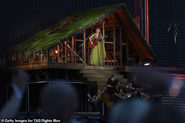 The singer then changed into a green dress for her album Evermore.