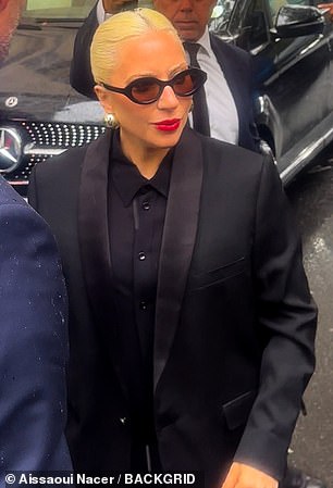 As always, she looked effortlessly chic with her platinum blonde locks slicked back into a neat ponytail, and her red lipstick adding a pop of color.