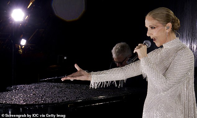 Céline Dion sings L'Hymne à l'Amour to close the opening ceremony