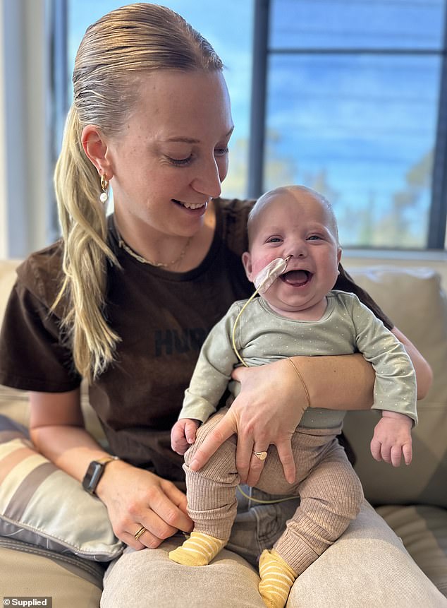 Rocco (pictured with his mother Skye Kennewell) underwent the first of three planned surgeries but will not be able to receive further treatment due to an adverse reaction.