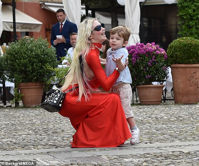 Grimes (pictured with X in Portofino in July 2023) begged Musk to let her see her son in a now-deleted post directed at her current partner Shivon Zilis.