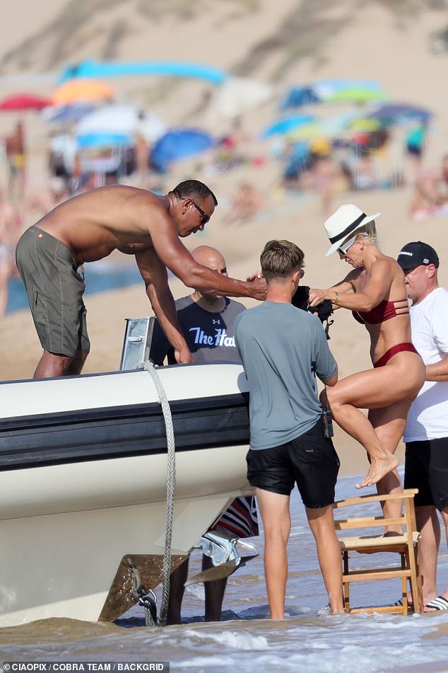 In addition to walking along the beach, the couple also enjoyed a ride on Rodriguez's boat.