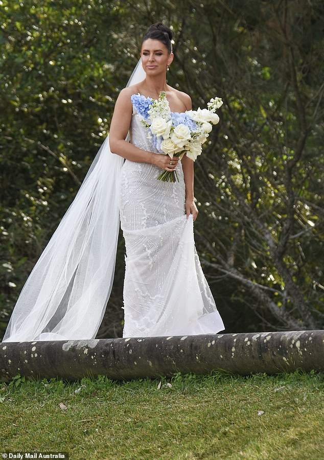 For the ceremony, Rhi looked every bit the blushing bride in a gorgeous strapless gown adorned with stunning embroidered details.