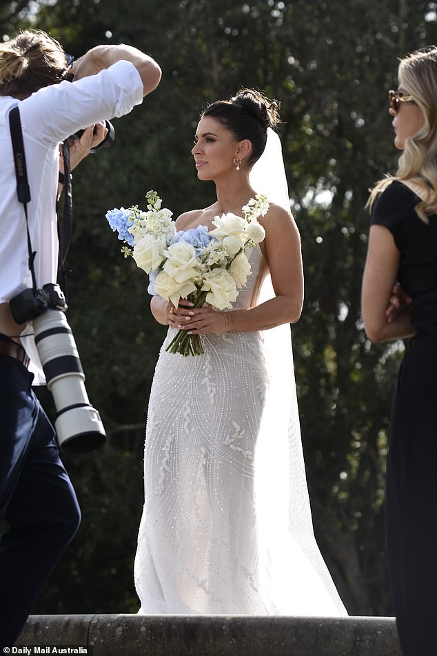 She showed off her stunning features with a high-glam makeup palette as she posed for gorgeous portraits from her wedding day.