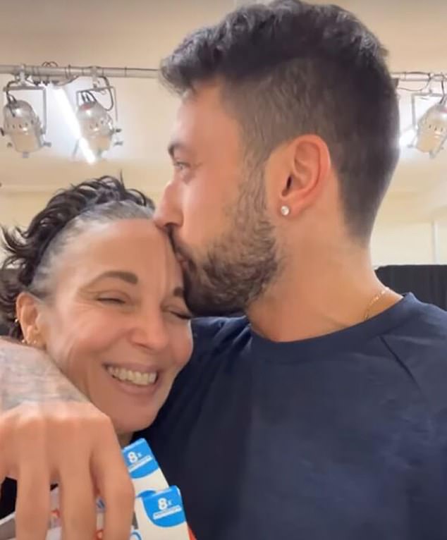 Pernice kisses Miss Abbington on the forehead during rehearsals for the dance contest.