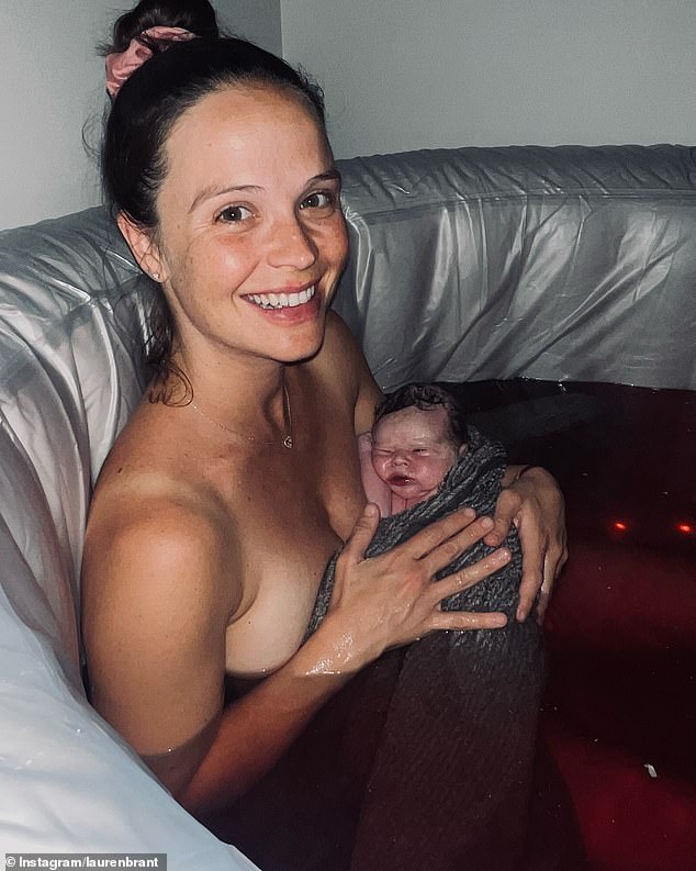 A series of images showed Lauren sitting in an inflatable pool of water, cuddling her newborn baby.