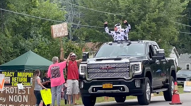 Locals were quick to rally to Gregson's side, staging protests outside Murphy's with men dressed in cow costumes, while others grilled steaks to mock vegans.