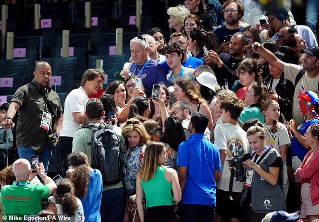 The Top Gun actor beamed for selfies with fans at the stadium