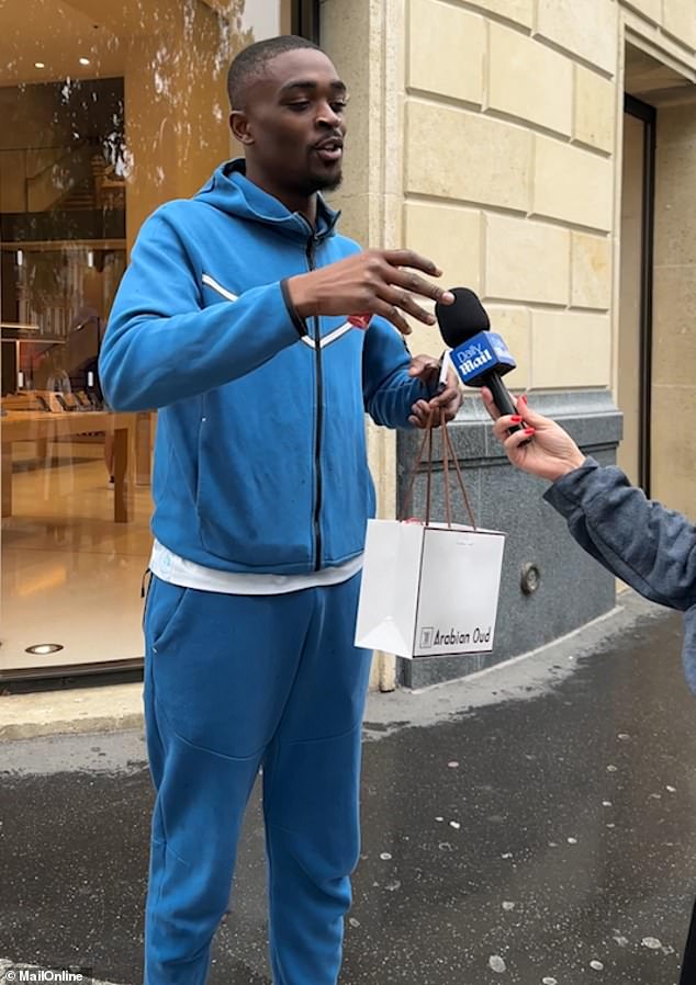 The man in the blue tracksuit is from the Congo but lives in Paris. He said that 