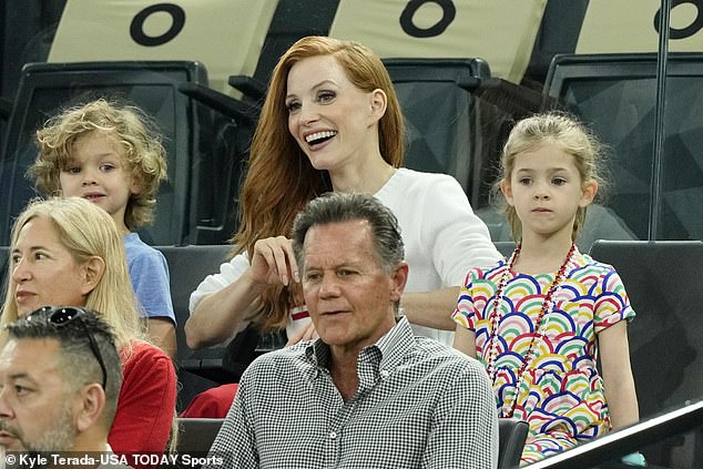 The Oscar-winning actress, 47, cut a radiant figure as she sat in the stands with her daughter Giulietta, six, and son Augustus, four.