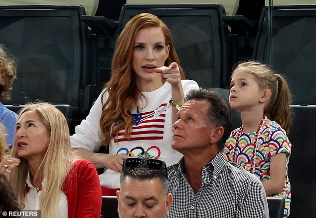 Jessica, the ever-loving mother, was seen hugging her two children and pointing out things to see in the sand and explaining the sport.