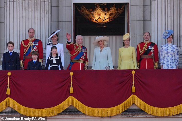 King Charles waves to the crowd from the balcony of Buckingham Palace during the parade on June 15. Pictured, from left: Prince George, the Prince of Wales, Prince Louis, Princess Charlotte, the Princess of Wales, King Charles, Queen Camilla, the Duchess of Edinburgh, the Duke of Edinburgh and Lady Louise Windsor