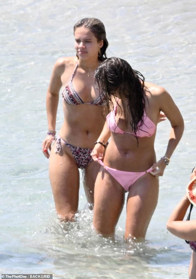 The Trigger Warning producer-star's 16-year-old mini-me wore a striped bikini top with leopard-print bottoms.