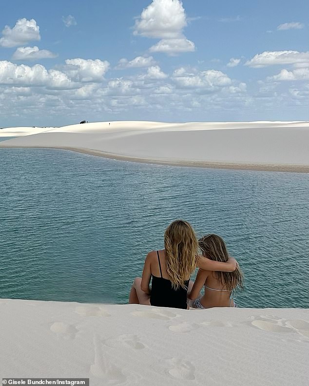 Bündchen was accompanied on the rolling sand dunes by her daughter Vivian Lake Brady (right).