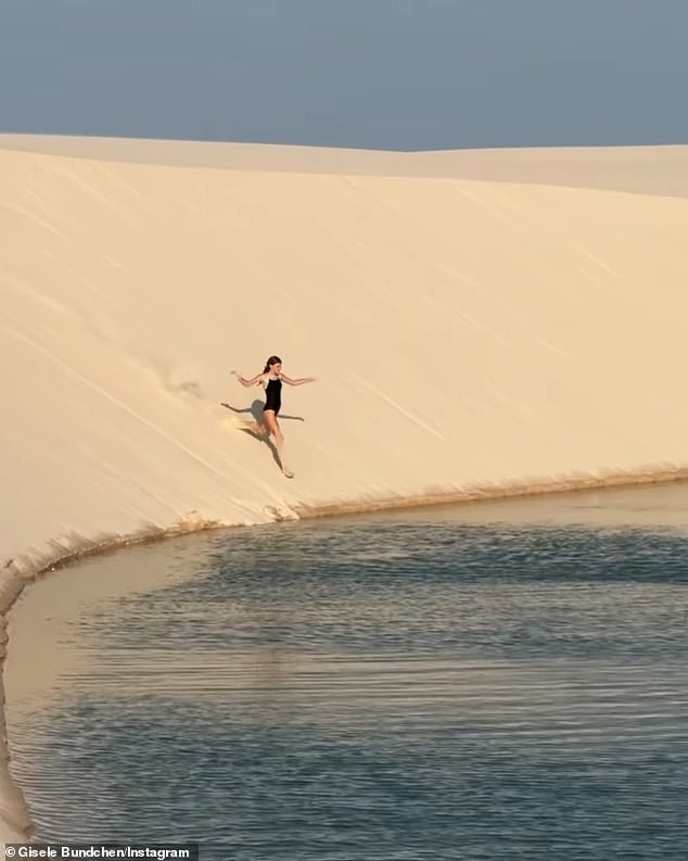 The CAA Fashion model shared a video of her 11-year-old mini-me running down one of the dunes and diving into a 10-foot-deep lagoon, which is said to reach temperatures of 81F-90F degrees.