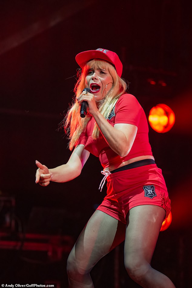 Paloma showed off her sensational figure for the performance in a tiny pair of red shorts and a matching red t-shirt that hugged her tiny frame and showed off a bit of her midriff.