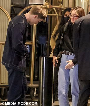 The couple put on a flirtatious display as they chatted in the hotel lobby.