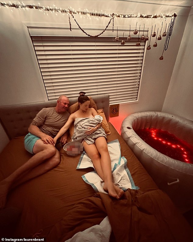 The couple shared a series of images showing them cradling Clay in a birthing pool lit with red lights, as well as Lauren on a bed cuddling the newborn while a container of placenta sat next to them.