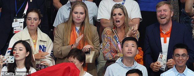 PASSIONATE: At one point, the Queen was seen screaming, while her husband smiled broadly as they watched the event.